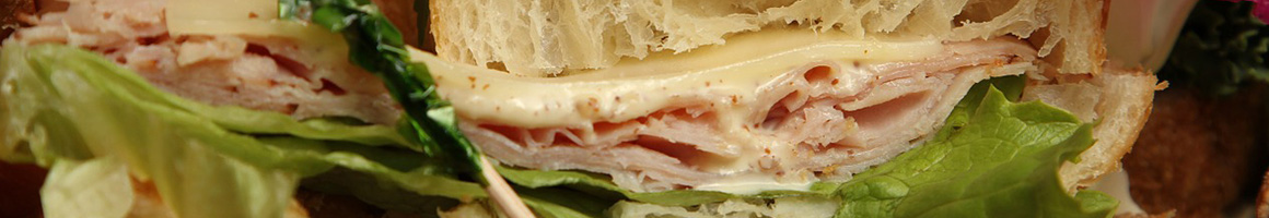 Eating Deli Sandwich at Groucho's Deli restaurant in Irmo, SC.